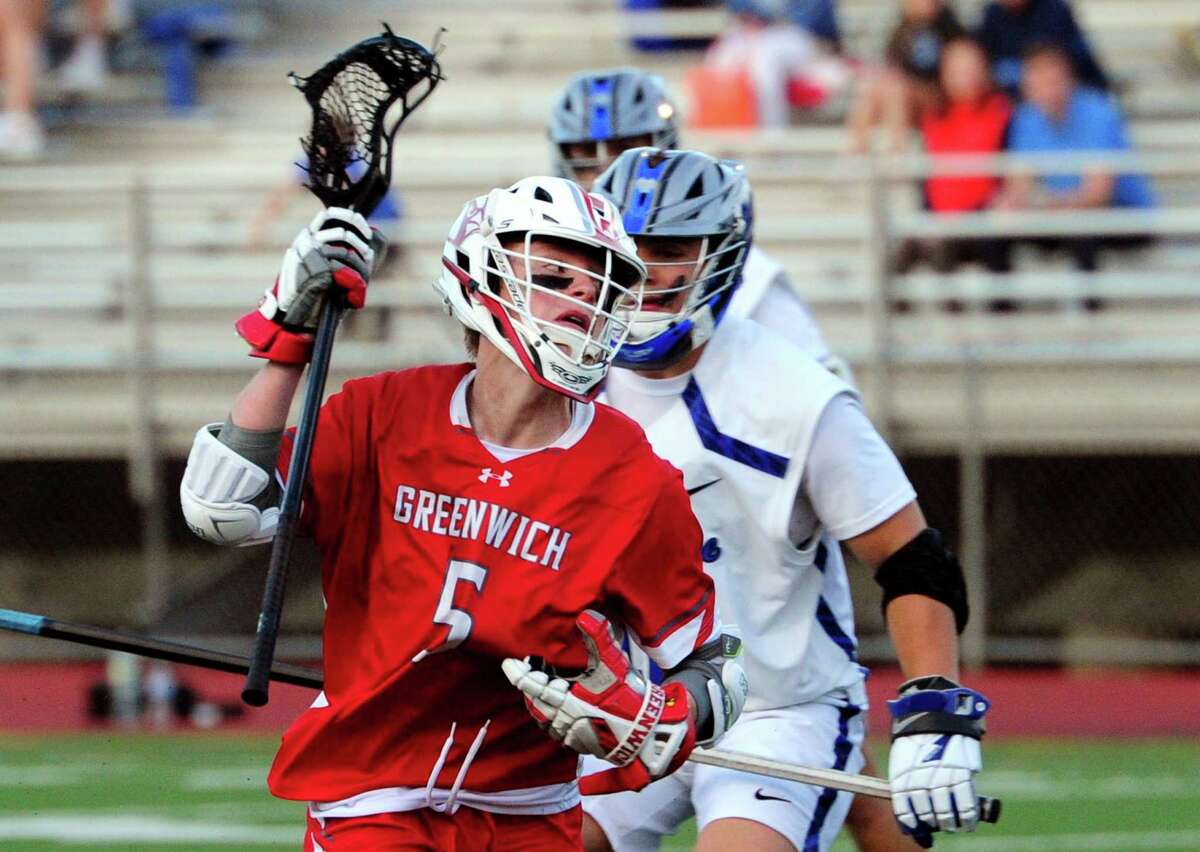 Greenwich's James Pilc looses the ball as he drives towards the goal during FCIAC boys lacrosse semifinal action against Darien at Brien McMahon High School Norwalk, Conn., on Tuesday May 24, 2022.