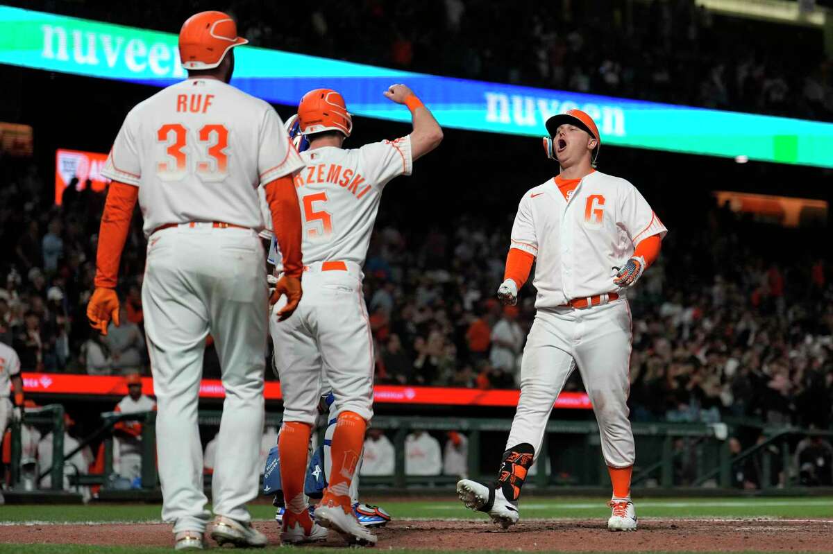 San Francisco Giants' Joc Pederson, right, celebrates with Mike Yastrzemski (5) and Darin Ruf (33) after hitting a three-run home run against the New York Mets during the eighth inning of a baseball game in San Francisco, Tuesday, May 24, 2022. (AP Photo/Tony Avelar)