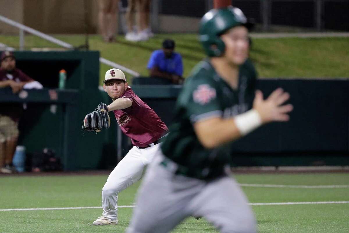 Summer Creek third baseman Aaron Hernandez, left, makes a throw to first base on the bunt by Strake Jesuit batter Harrison Acquaro, right, during their Region III-6A quarterfinal baseball game held at the Univeristy of Houston Friday, May 20, 2022 in Houston, TX.