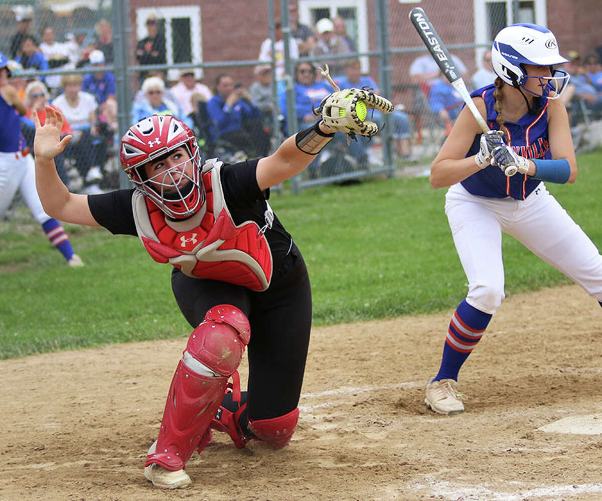Calhoun catcher Ella Sievers extend to glove a pitch high and outside against Okawville on Tuesday at the Marissa Class 1A Sectional.