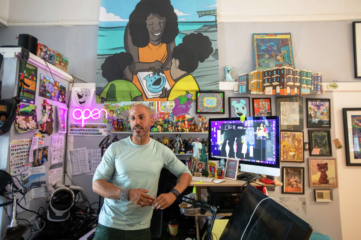 Muralist Sirron Norris shows some of character designer Jay Howell's drawings he helped to color and animate for the pilot episode of "Bob's Burgers" at the workspace of his art studio in San Francisco, Calif. on May 3, 2022.
