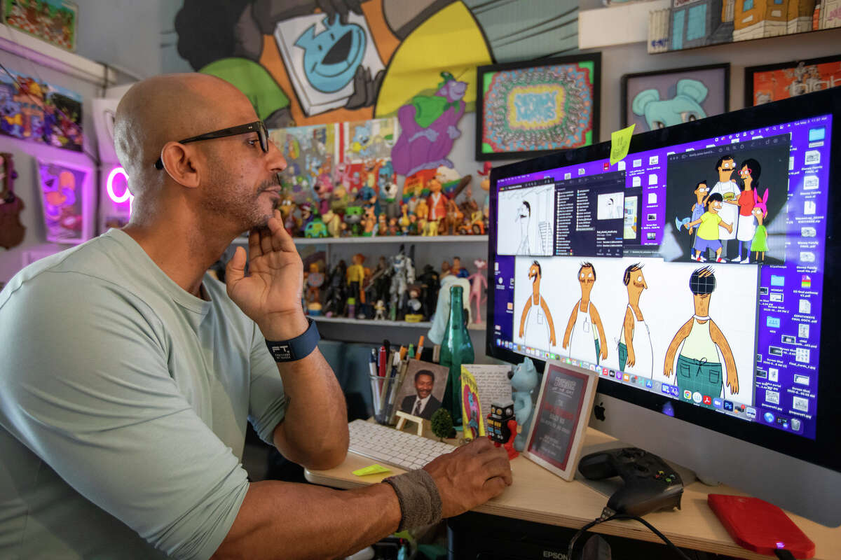 Illustrator Sirron Norris shows some of the sketches he created for the pilot episode of Bob's Burgers at his art studio in San Francisco, Calif. on May 3, 2022.