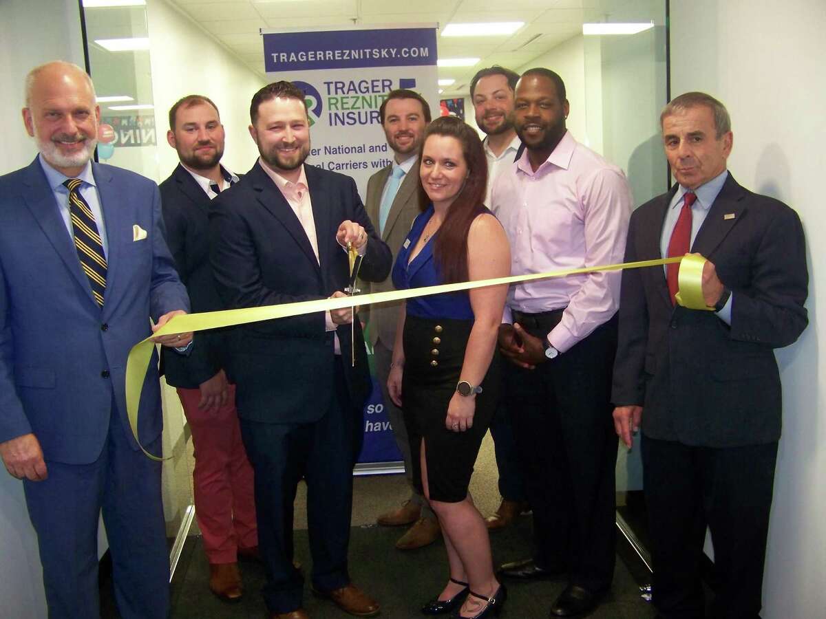 From left, Quinnipiac Chamber of Commerce Executive Director Ray Andrewsen, Trager Reznitsky Insurance Agency Sales Director Michael LoPresti Jr., Principal Agent Commercial Lines Eugene Reznitsky, Senior Partner Jonathon Cawley, Operations Manager Amy Morin, Principal Agent Personal Lines Joshua Trager, Agency Sales Director Kyle Settle and North Haven First Selectman Mike Freda