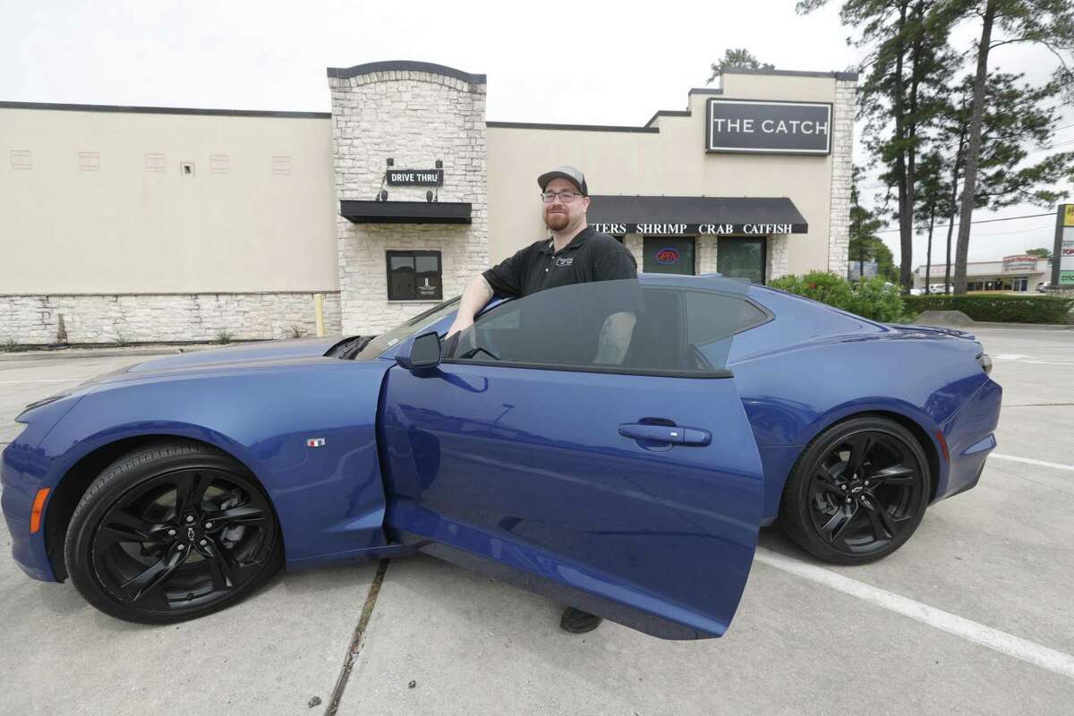 Justin Vough is seen with his recently purchased Camero, Tuesday, May 24, 2022, in Conroe. Vough is a 2017 graduate of Eagles Nest Ministries’ Soaring Eagles Academy to give inmates a soft landing as they re-enter society.