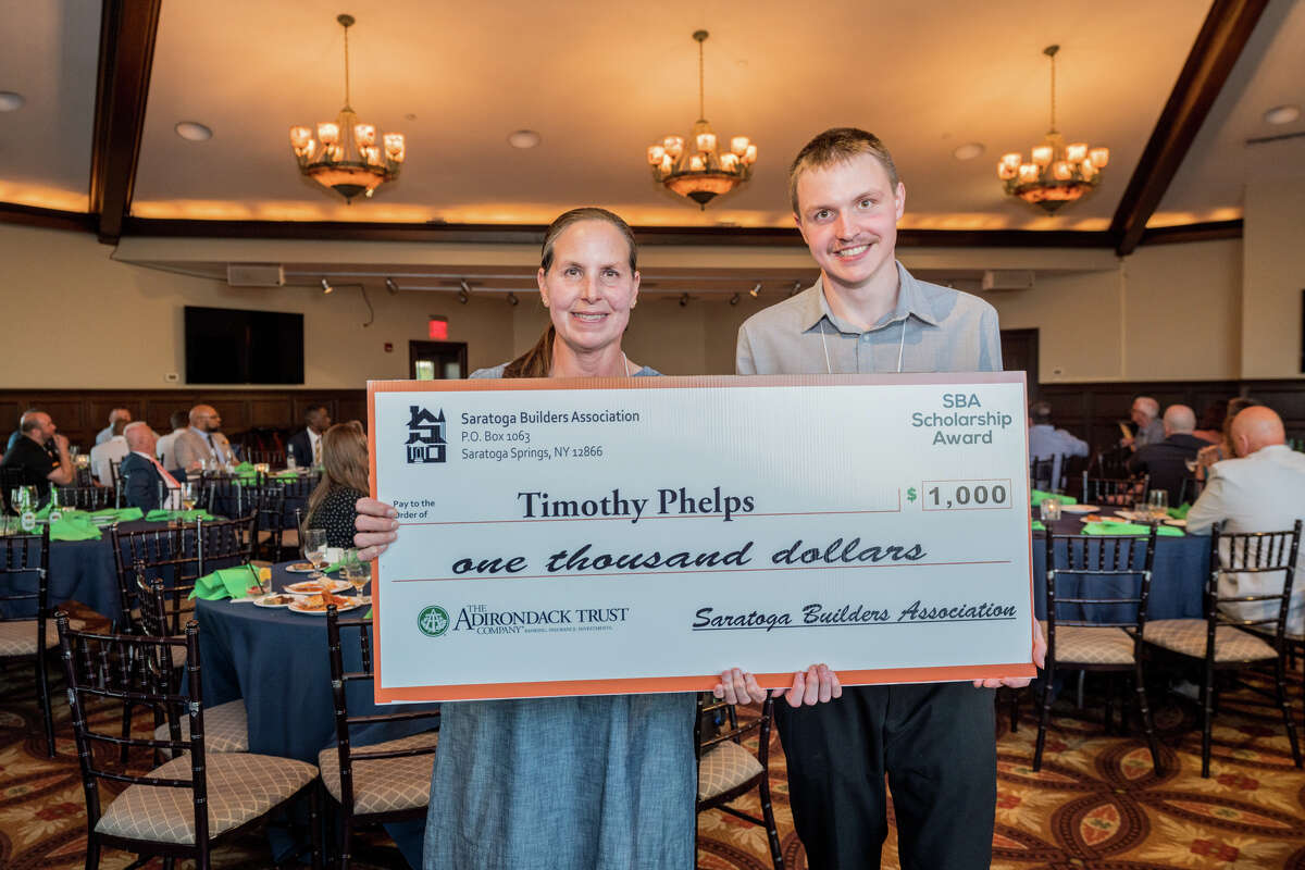 Timothy Phelps with his mother, Julie, won a scholarship from the Saratoga Builders Association.