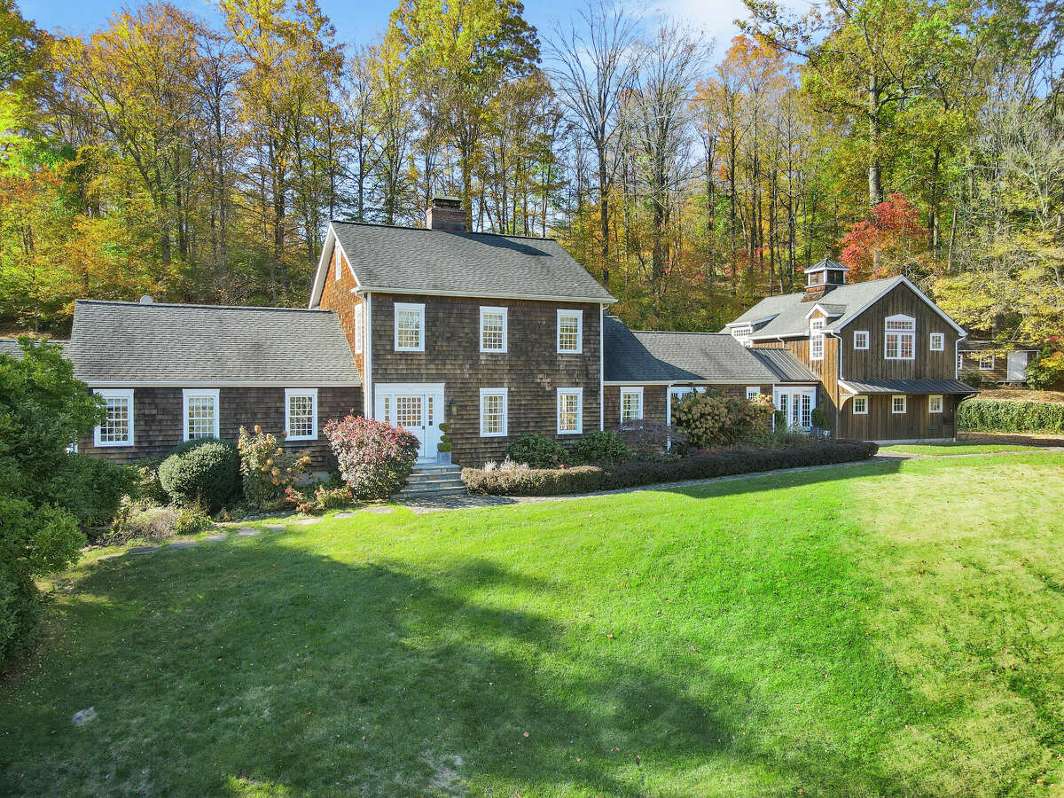 The home on 215 Cross Ridge Road in New Canaan, Conn. has five bedrooms and five full bathrooms spread across three levels of living space. 