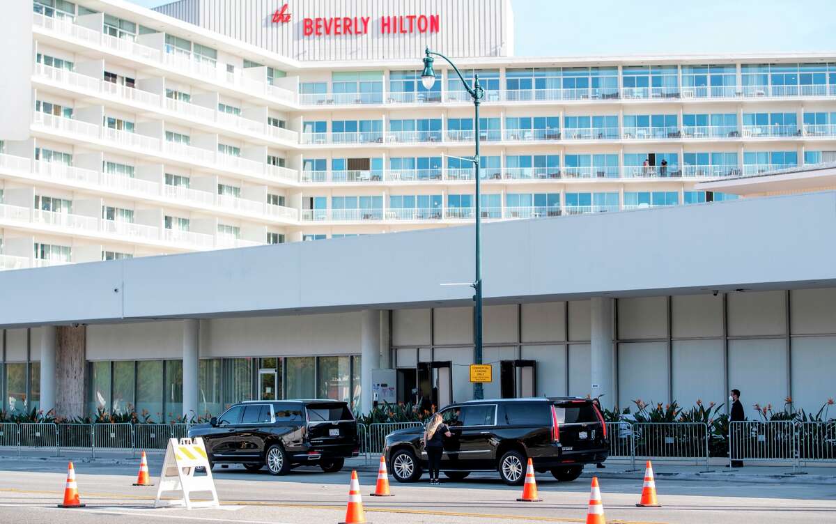SUVs drop off guests in front of the Beverly Hilton Hotel where the Golden Globe Awards took place Feb. 28, 2021, in Beverly Hills, Calif.