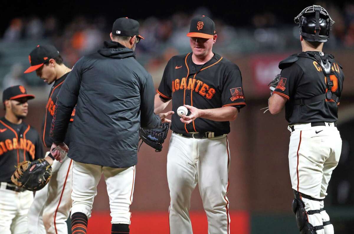San Francisco Giants’ relief pitcher Jake McGee is removed in St. Louis Cardinals’ 4-run 7th inning during MLB game at Oracle Park in San Francisco, Calif., on Thursday, May 5, 2022.