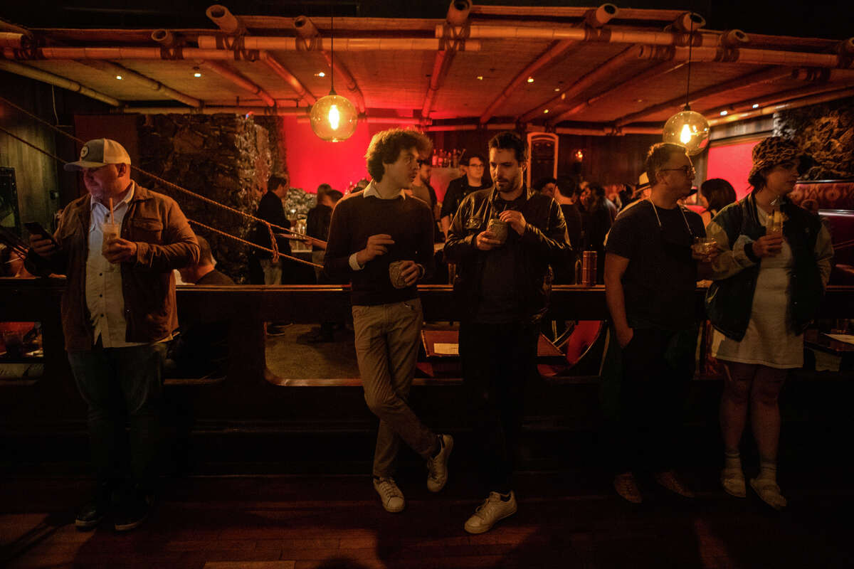 Patrons consume their drinks inside the Tonga Room in the Fairmount Hotel, in San Francisco, Calif. on May 20, 2022.