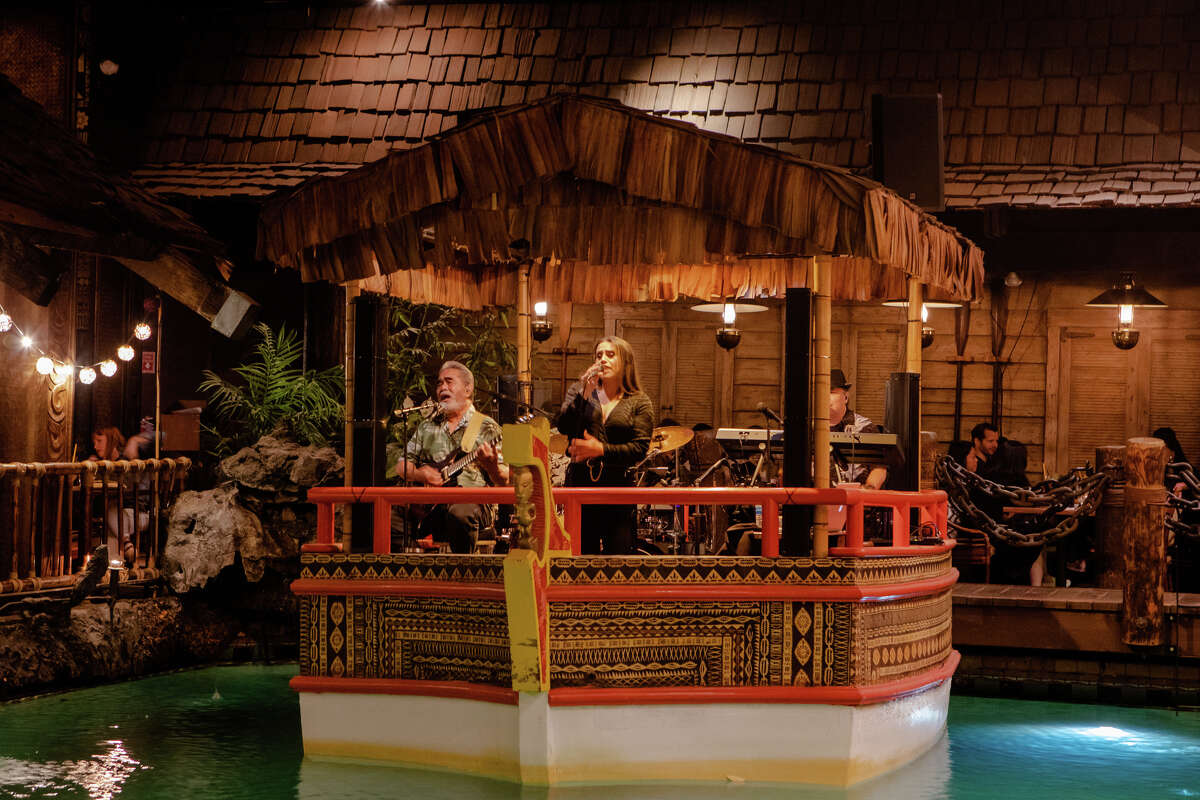 The Island Groove Band performs on a boat on the pool at the Tonga Room in the Fairmont Hotel, in San Francisco, Calif. on May 20, 2022.