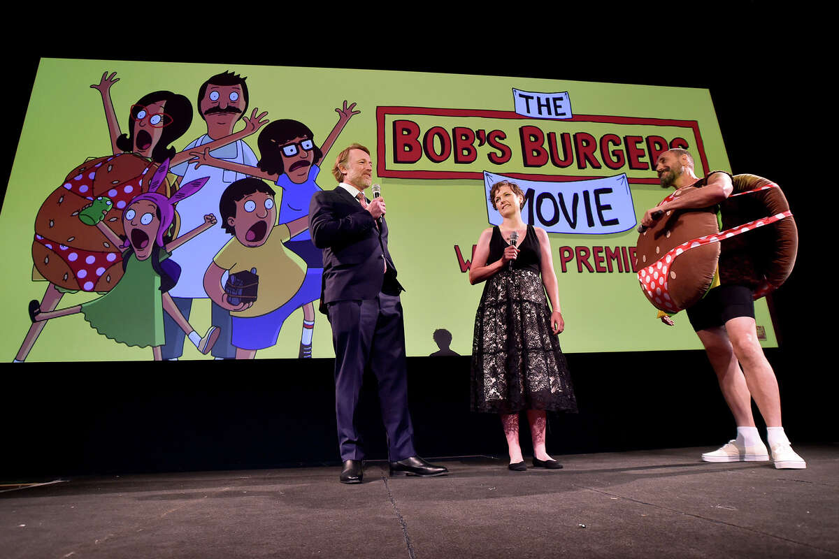From left: Movie director Bernard Derriman, with Bob's Burgers creators Nora Smith and Loren Bouchard,  during the world premiere of 20th Century Studios "The Bobs Burgers Movie" at El Capitan Theatre in Hollywood, California on May 17, 2022. 