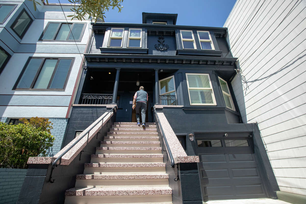 SFGATE columnist Drew Magary walks into 231 12th Ave., a house for sale in San Francisco on May 24, 2022. He is inspecting the state of the real estate market in San Francisco.