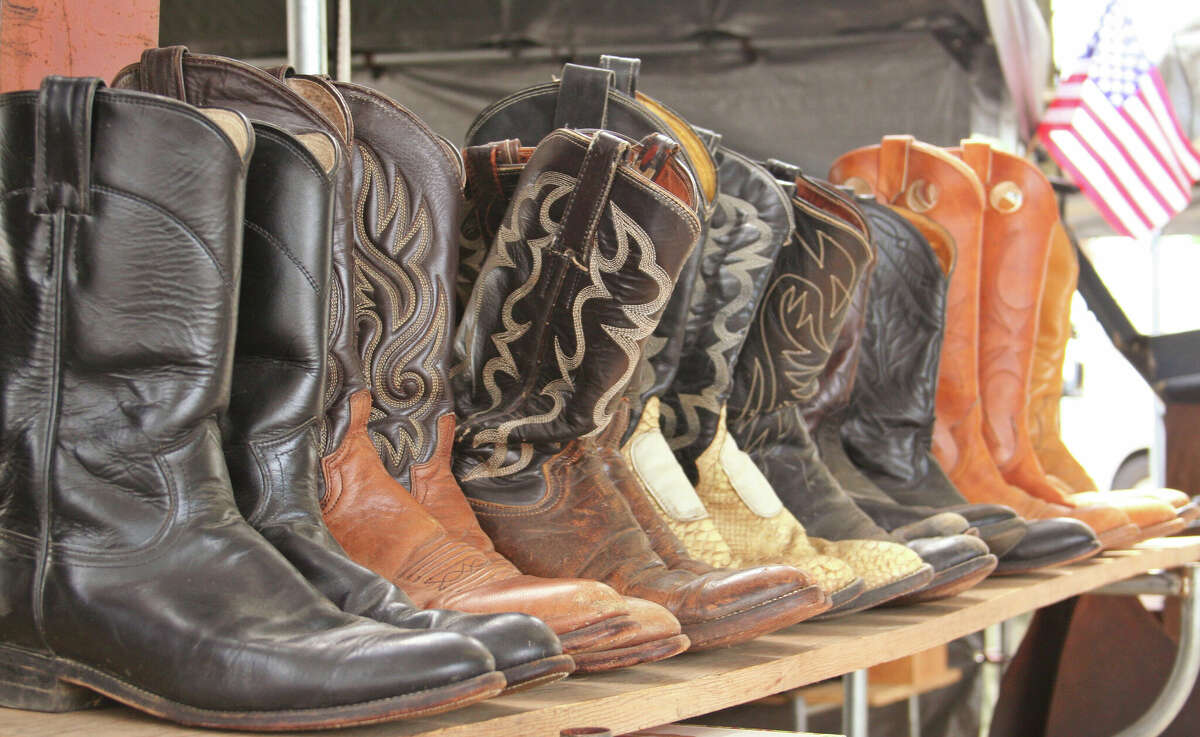 Old shoes for sale at a flea market.