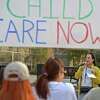 Child-care advocates rally in Danbury in March 2022, calling for more state support for working parents. Gov. Ned Lamont signed multiple bills to address the issue, including a tax credit covering some of the costs of child care, and a bill requiring the state to help women find better paying jobs.