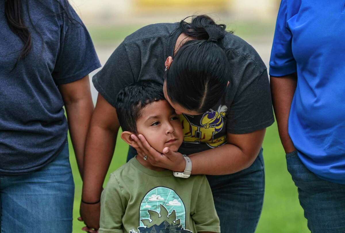 Aiden Garcia, 4, receives the affection of his mother, Zenaida Buruato Aguero, during a prayer vigil in Uvalde after at least 19 students and two adults were killed in a mass shooting at Robb Elementary School in Uvalde, Texas, on Tuesday, May 24, 2022.