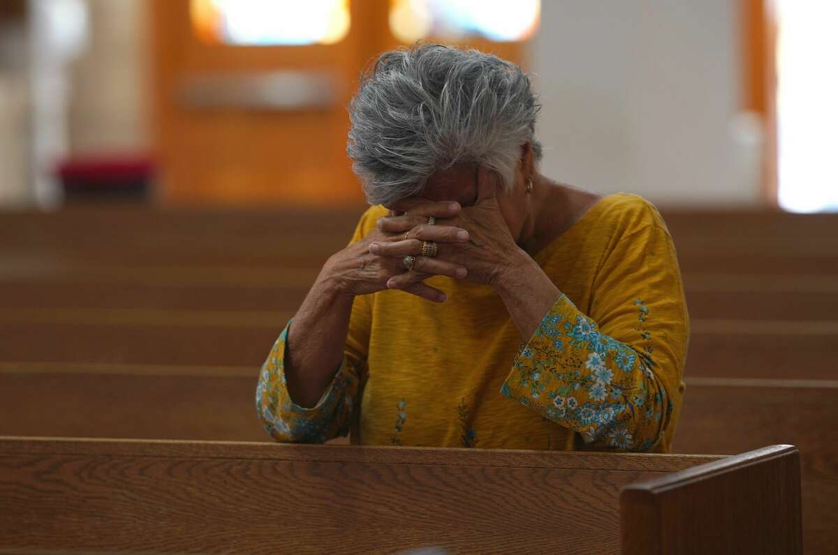 Catholic faithful attend a Mass at Sacred Heart Catholic Church in Uvalde Texas, on May 25, 2022, one day after a gunman opened fire at Robb Elementary school. - The tight-knit Latino community of Uvalde was wracked with grief Wednesday after a teen in body armor marched into the school and killed 19 children and two teachers, in the latest spasm of deadly gun violence in the US. (Photo by allison dinner / AFP) (Photo by ALLISON DINNER/AFP via Getty Images)