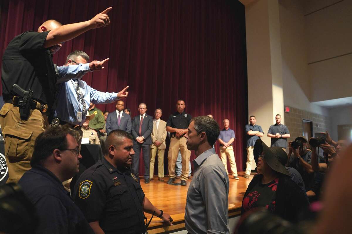 Democratic gubernatorial candidate Beto O'Rourke interrupts Texas Governor Greg Abbott during a press conference to provide updates on the Uvalde elementary school shooting, at Uvalde High School in Uvalde, Texas on May 25, 2022. - The tight-knit Latino community of Uvalde was wracked with grief Wednesday after a teen in body armor marched into the school and killed 19 children and two teachers, in the latest spasm of deadly gun violence in the US. (Photo by allison dinner / AFP) (Photo by ALLISON DINNER/AFP via Getty Images)