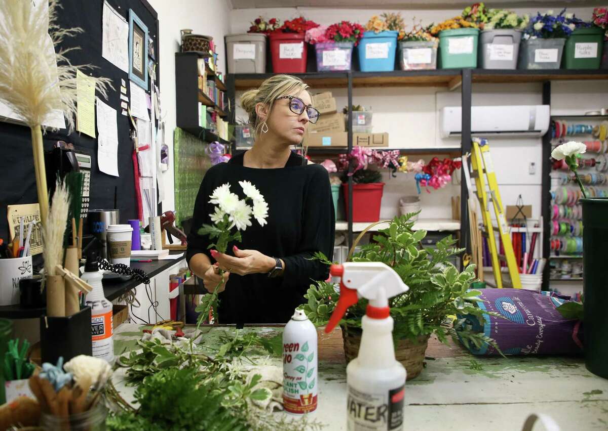 Kelly J. Baker, owner of Flower Patch, puts together a floral arrangement for one of the victims of the Robb Elementary School mass shooting, on Wednesday, May 25, 2022, in Uvalde, Texas. Baker said they’ve been overwhelmed with arrangement requests after 21 people, including 19 chidden, were killed yesterday.