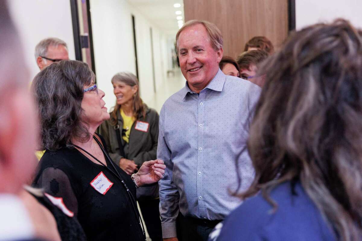 Attorney General Ken Paxton talks with supporters during his election night watch party at Wilco Work Space in Cedar Park, Texas, Tuesday, May 24, 2022.