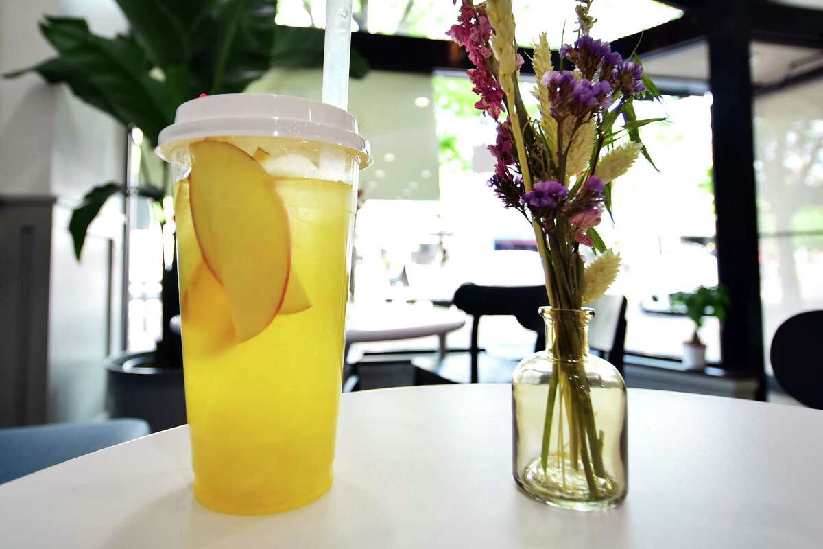 A signature fruit tea on display at Shiro Desserts and Drinks on Bedford Street in Stamford, Conn., on Tuesday May 24, 2022. Shiro, which offers Asian-inspired desserts and tea drinks, opend last week by Sabrina Yang, a student at UConn Stamford majoring in business management.