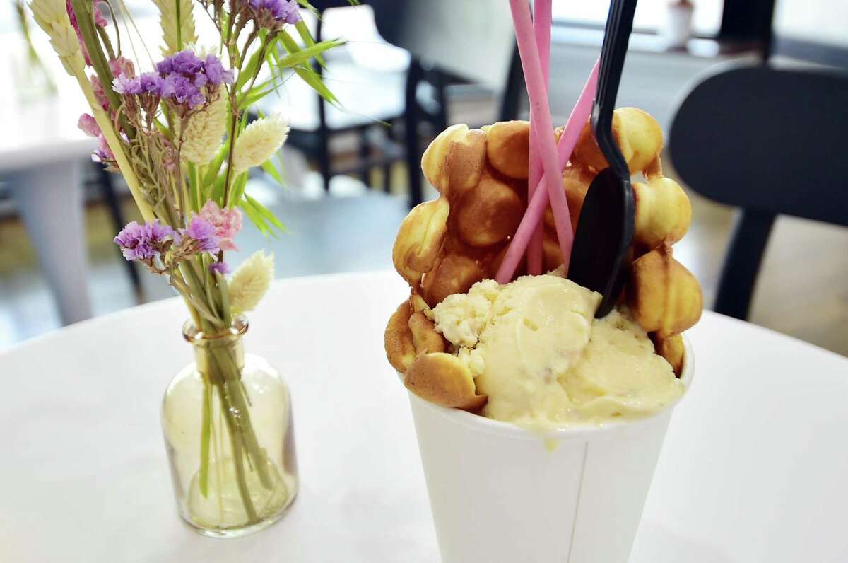 Hong Kong Bubble Waffle with ice cream on display at Shiro Desserts and Drinks on Bedford Street in Stamford, Conn., on Tuesday May 24, 2022. Shiro, which offers Asian-inspired desserts and tea drinks, opend last week by Sabrina Yang, a student at UConn Stamford majoring in business management.