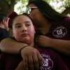 Adalynn Madrigal, 9, is comforted by her mother Monique after the family dropped off a teddy bear for victims of the mass shooting Wednesday, May 25, 2022, near Robb Elementary School in Uvalde. Madrigal’s father Mark said the family lost two cousins and two others were wounded in the mass shooting the day before. Adalynn said she hadn’t slept since hearing the gunshots. “How do you comfort a child that’s broken, all you can do is hold them,” her father Mark said.