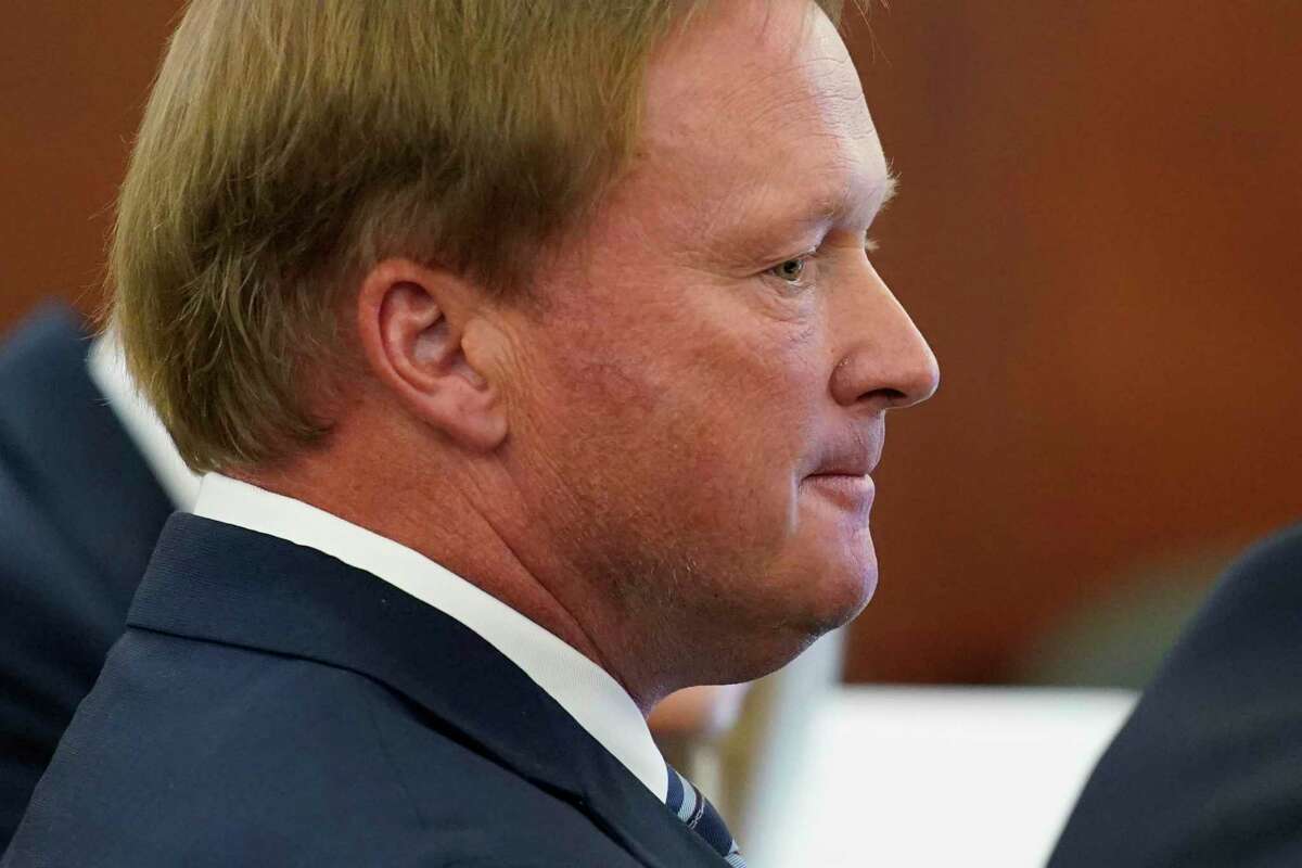 Jon Gruden listens in court Wednesday, May 25, 2022, in Las Vegas. A Nevada judge heard a bid Wednesday by the National Football League to dismiss former Las Vegas Raiders coach Jon Gruden's lawsuit accusing the league of a "malicious and orchestrated campaign" including the leaking of offensive emails ahead of his resignation last October. (AP Photo/John Locher)