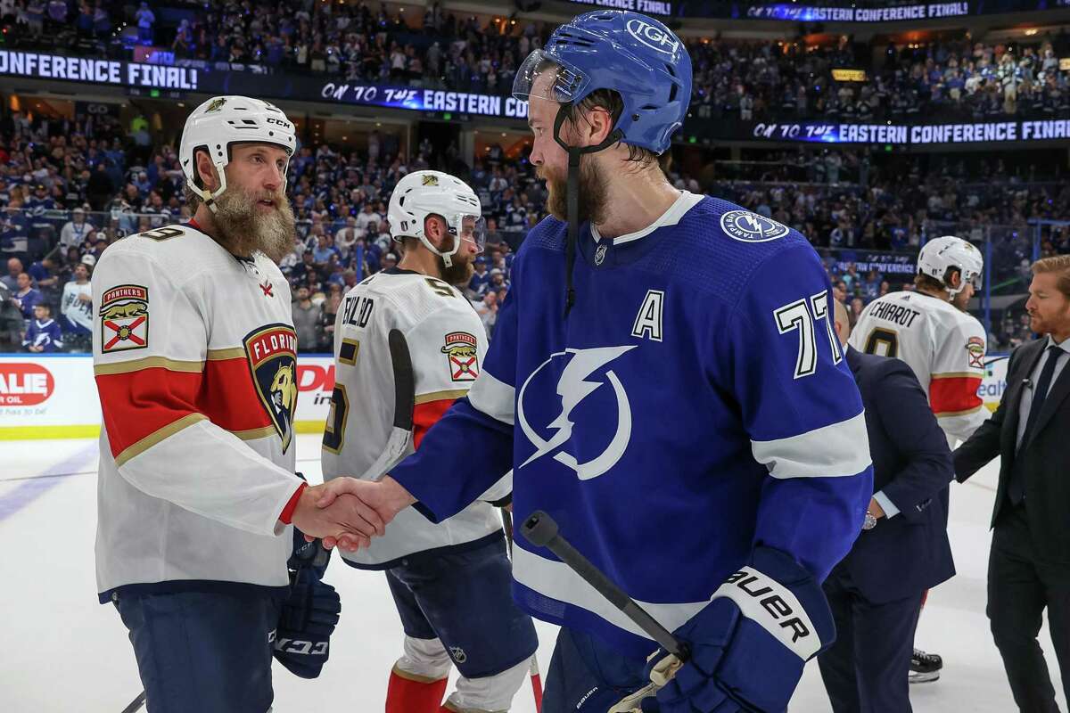 TAMPA, FL - MAY 23: Joe Thornton #19 of the Florida Panthers shakes hands with Victor Hedman #77 of the Tampa Bay Lightning after Game Four of the Second Round of the 2022 Stanley Cup Playoffs at Amalie Arena on May 23, 2022 in Tampa, Florida. (Photo by Mike Carlson/Getty Images)