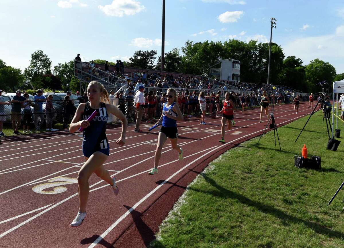 Saratoga pulls an early lead in the girl’s 4x800 relay start their race during the Section II Group 1 track sectionals on Wednesday, May 25, 2022, at Colonie High School in Colonie, N.Y.
