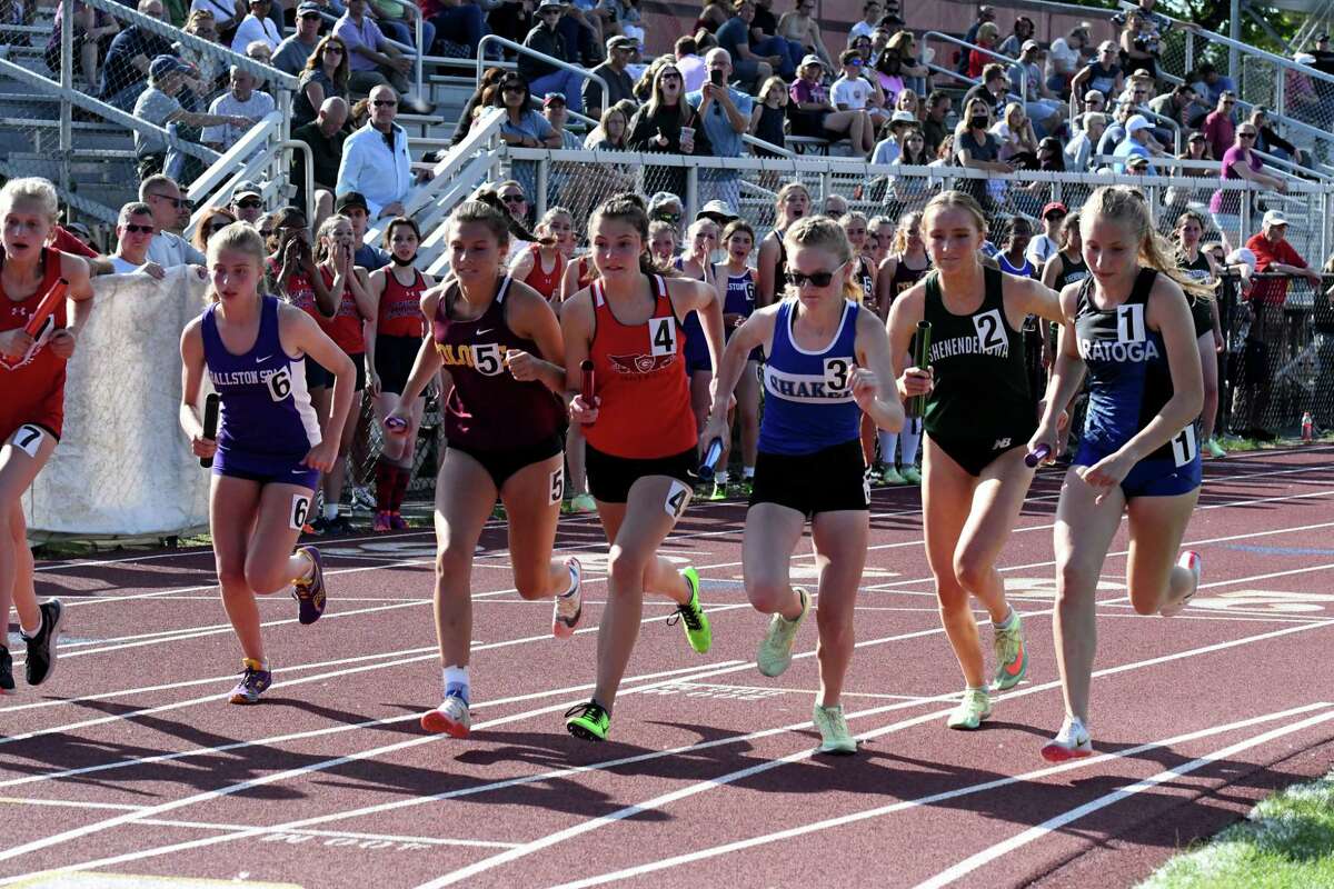 Competitors in the girl’s 4x800 relay start their race during the Section II Group 1 track sectionals on Wednesday, May 25, 2022, at Colonie High School in Colonie, N.Y.