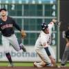 Cleveland Guardians second baseman Ernie Clement (28) makes the throw to first base as Houston Astros Mauricio Dubon (14) ground into a double play during the fourth inning of an MLB game at Minute Maid Park on Wednesday, May 25, 2022 in Houston.