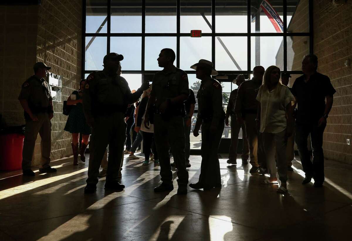 Texas State Troopers enter the Uvalde County Fairplex for a vigil in remembrance of the 21 people, including 19 children, who were killed at the Robb Elementary School mass shooting, on Wednesday, May 25, 2022, in Uvalde, Texas.