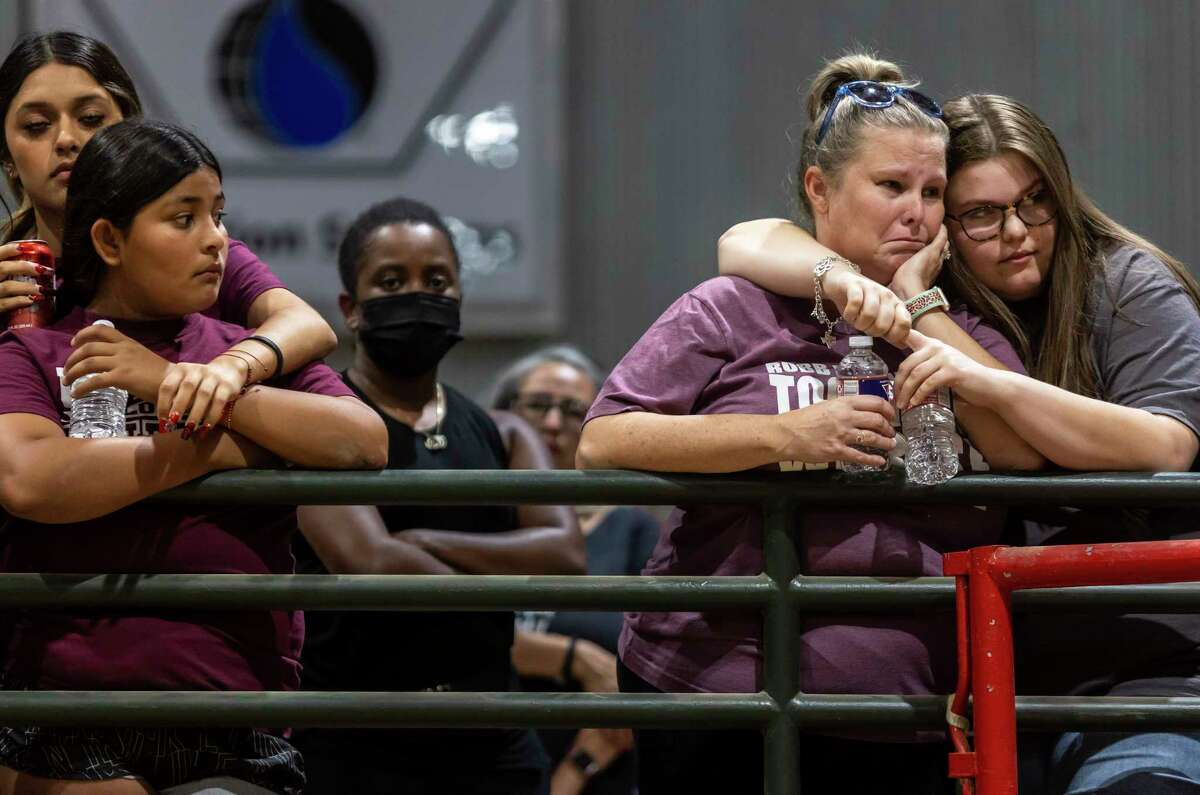 Nicole Ogburn is comforted by her 17-year-old daughter Trinity Ogburn during a vigil held in honor of the lives lost at Robb Elementary the day before at the Uvalde County Fairplex Arena in Uvalde, Texas, on May 25, 2022.