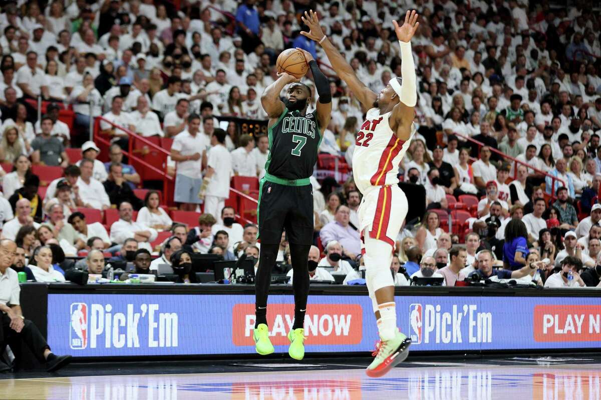 MIAMI, FLORIDA - MAY 25: Jaylen Brown #7 of the Boston Celtics shoots the ball against Jimmy Butler #22 of the Miami Heat during the fourth quarter in Game Five of the 2022 NBA Playoffs Eastern Conference Finals at FTX Arena on May 25, 2022 in Miami, Florida. NOTE TO USER: User expressly acknowledges and agrees that, by downloading and or using this photograph, User is consenting to the terms and conditions of the Getty Images License Agreement. (Photo by Andy Lyons/Getty Images)