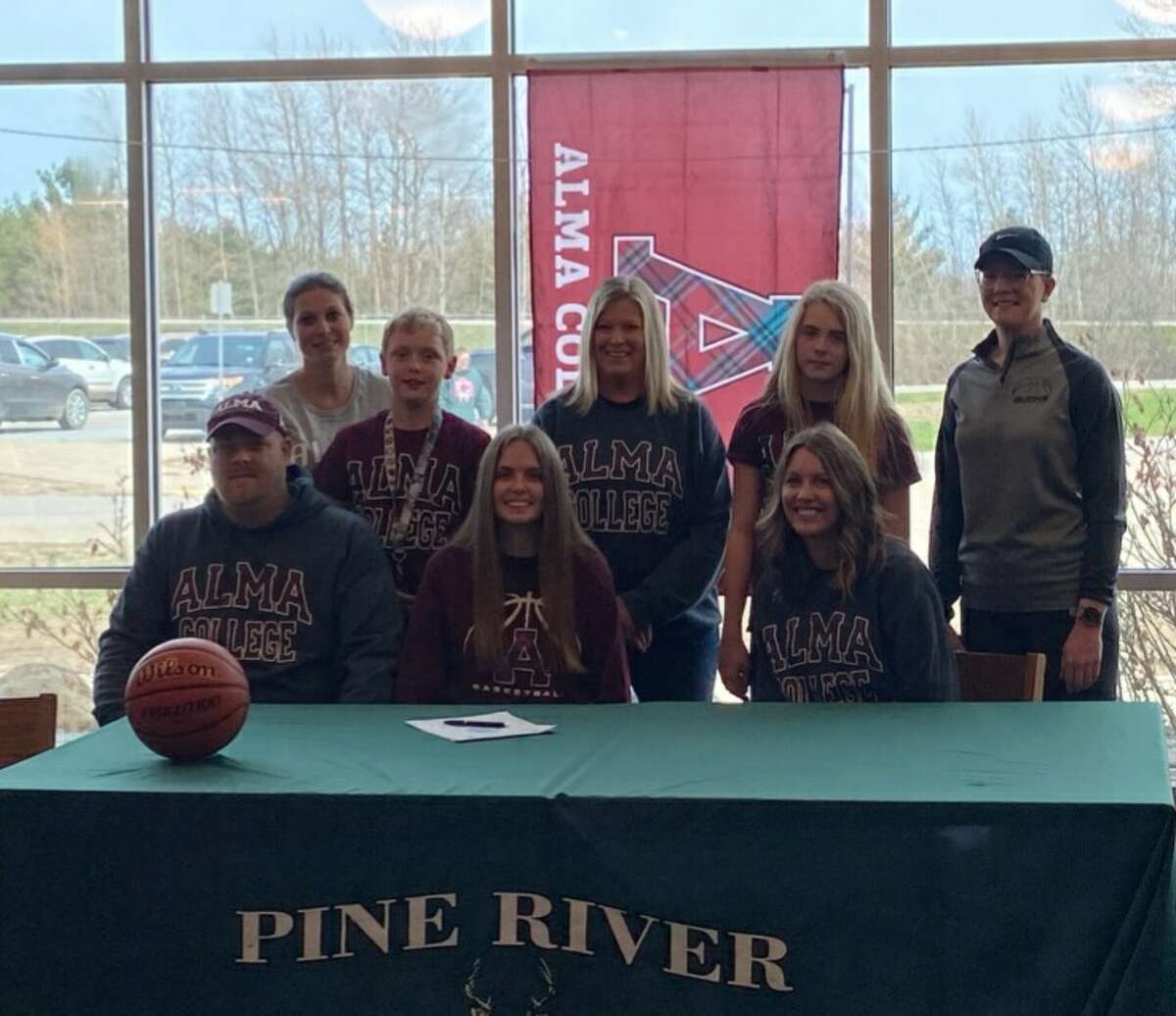 Attending Hailey Wanstead's signing in Pine River to play college basketball at Alma College recently were, from left, her parents Eric and Jessie Wanstead with Hailey in the midde; back, from left, assistant Pine River coach Deanna Draper, brother Tristan Wanstead, Pine River head coach Paula Justin, sister Madie Wanstead and assistant coach Jamie Martin.
