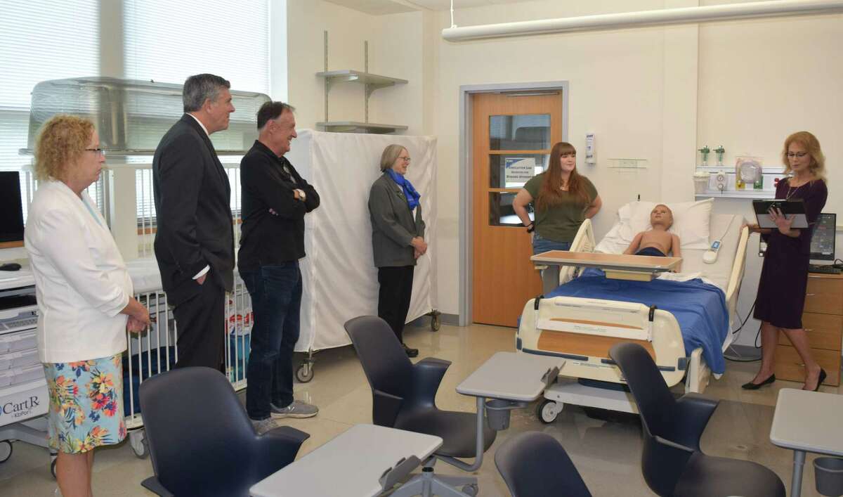 Congressman Darin LaHood joins others in touring Illinois College's nursing simulation lab alongside faculty members and representatives of Jacksonville Memorial Hospital.