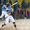 Midland High's Grace Schloop takes a swing during an April 25, 2022 game against Grand Blanc.
