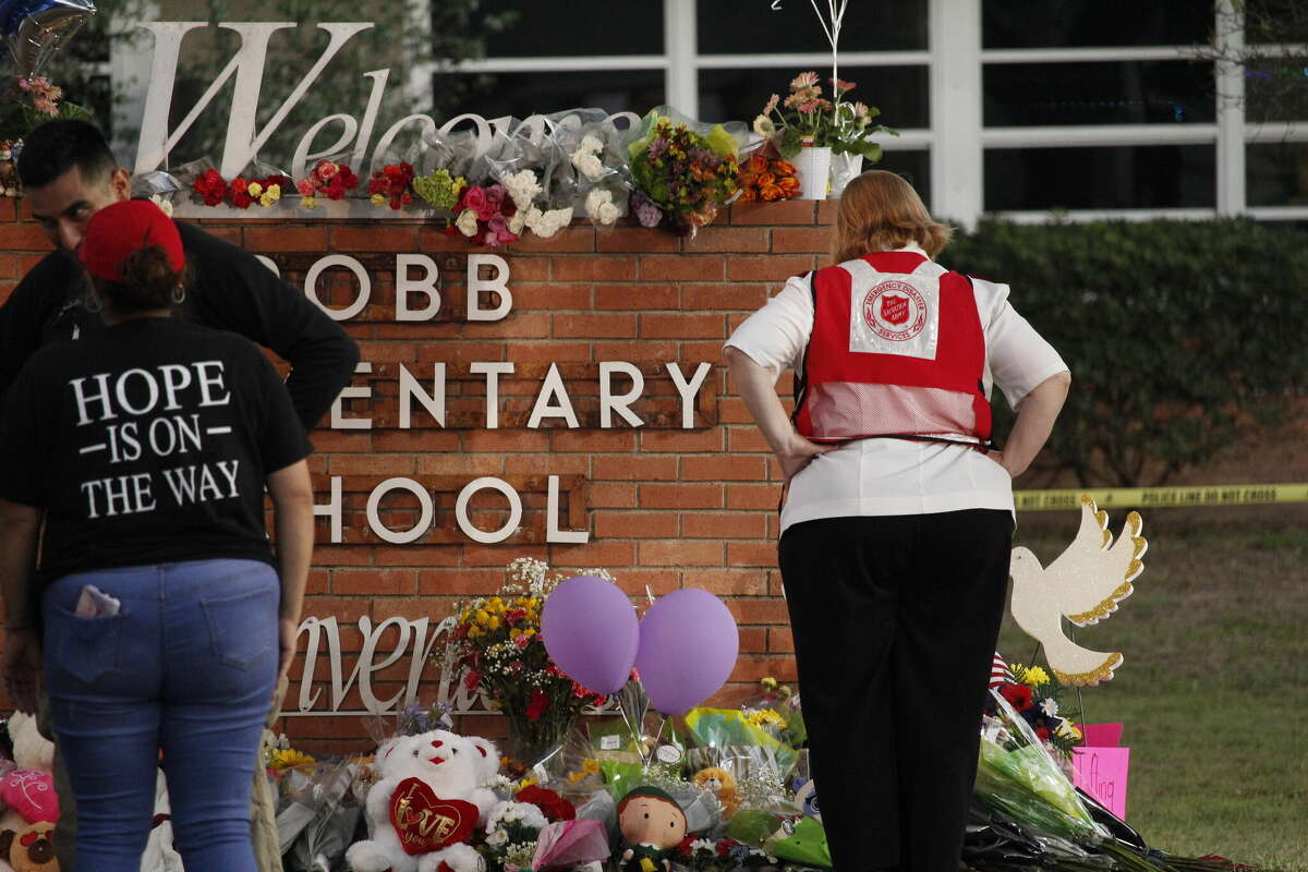 The public laid flowers, gifts and other items at Robb Elementary School in Uvalde, Texas, following the May 24 mass shooting.