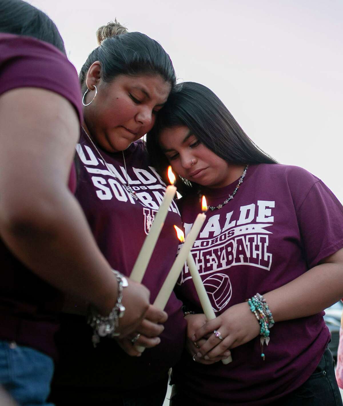 People comfort each other following a vigil held at the Uvalde County Fairplex Arena in Uvalde, Texas, Wednesday, May 25, 2022. (Josie Norris/The San Antonio Express-News via AP)