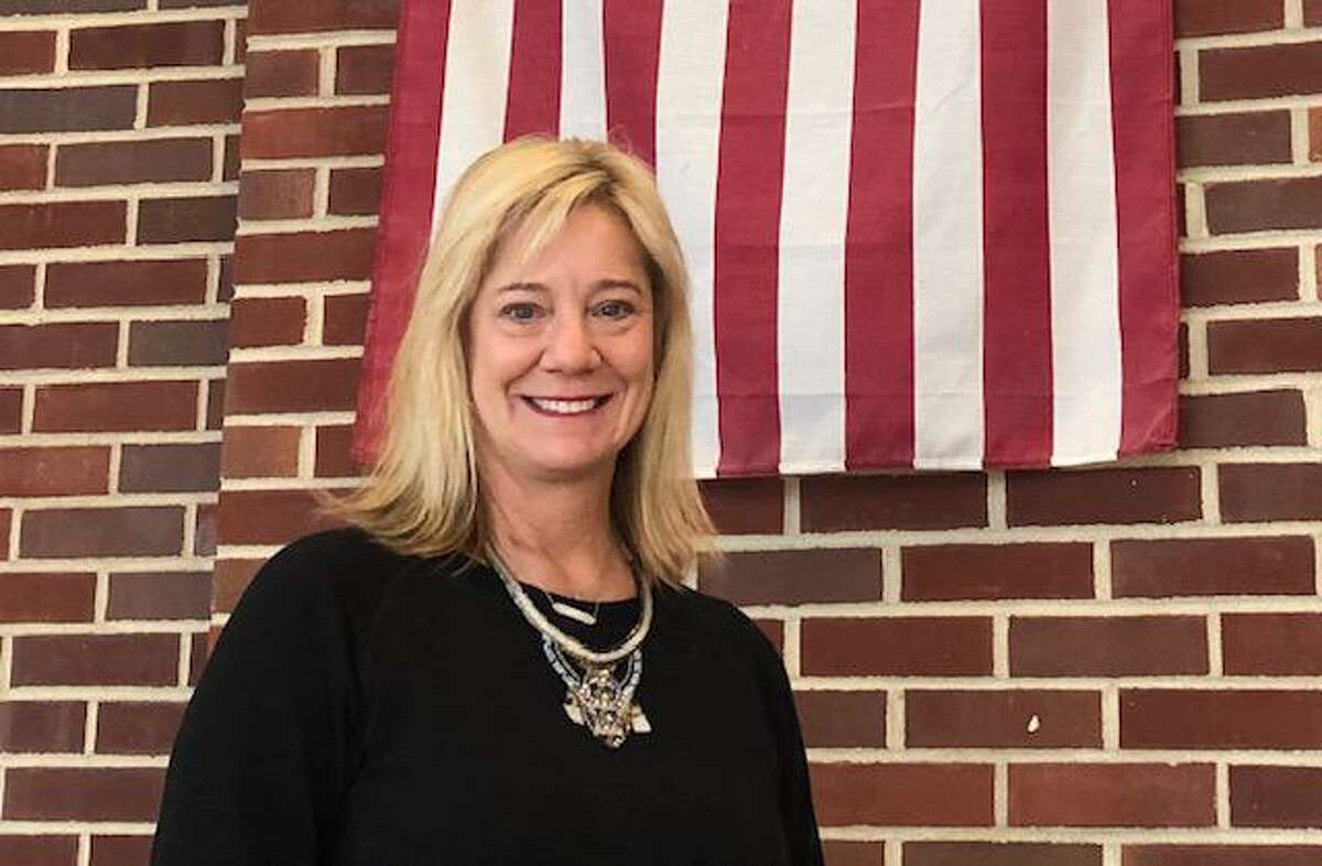 Eighth grade history teacher Lucy Berry created a program in Darien to honor town veterans by putting their names on street signs. She teaches at Middlesex Middle School.