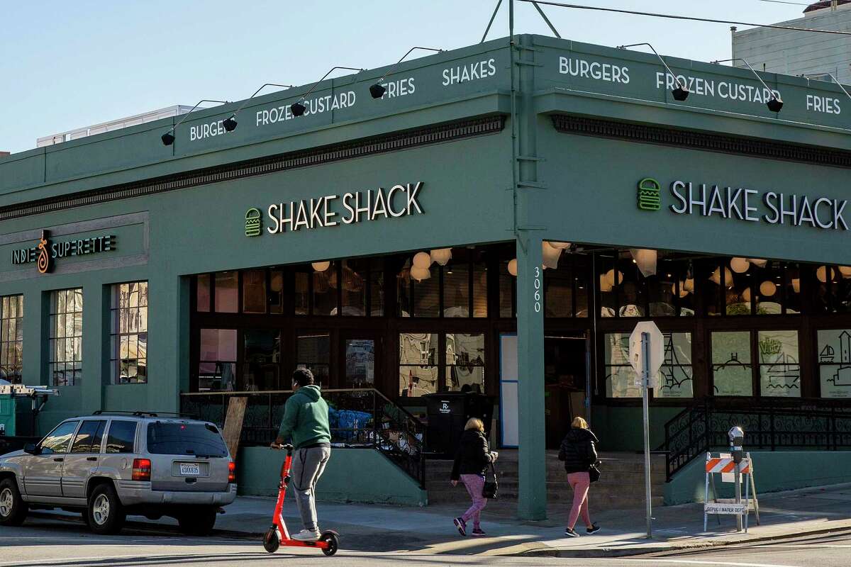 People outside one of two San Francisco Shake Shacks in 2019. The chain is continuing to expand throughout the Bay Area.