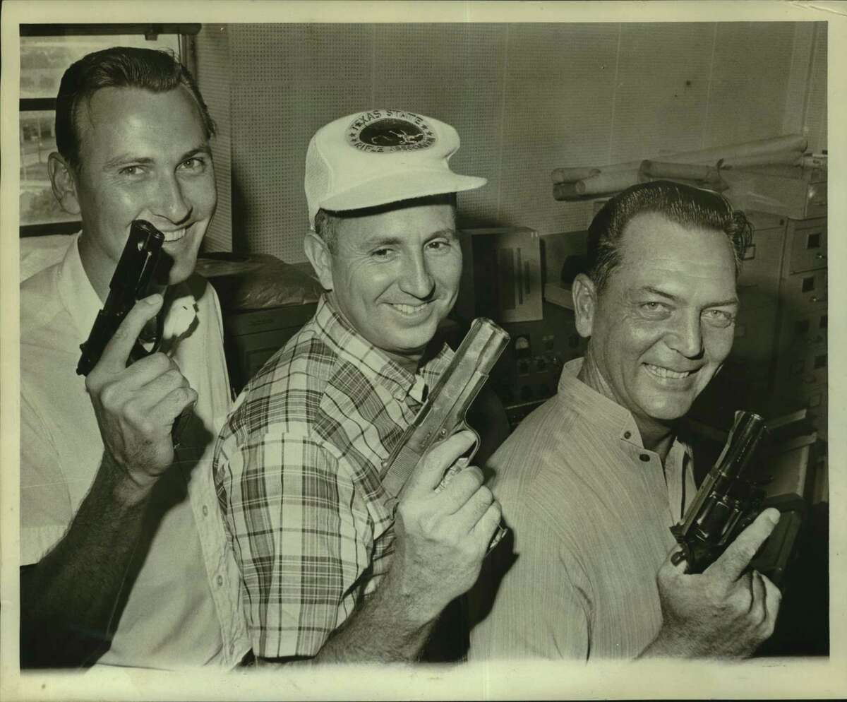 In this 1966 photograph, three members of the Houston police pistol team pose before heading to National Rifle Association shooting matches in Dallas and Camp Perry, Ohio.
