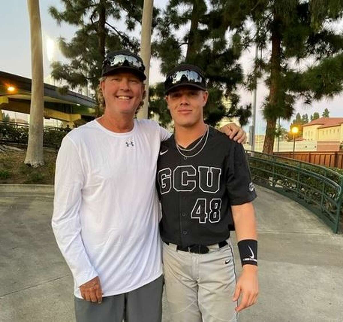 Sean Snedeker (left) is the pitching coach for Lamar University baseball. His son, Sy, is a catcher for Grand Canyon. 