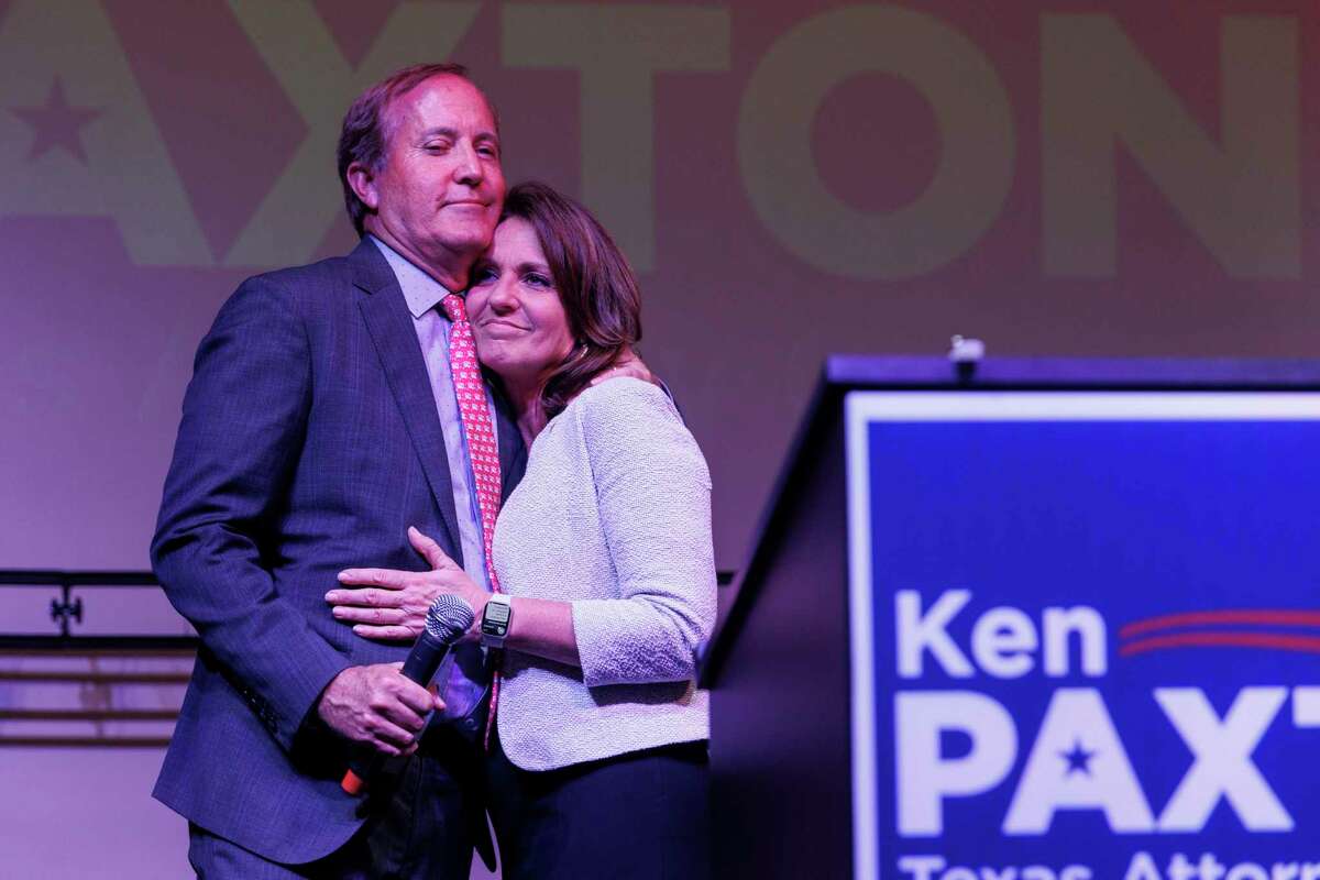 Attorney General Ken Paxton embraces his wife Sen. Angela Paxton before addressing his supporters during his election night watch party at Wilco Work Space in Cedar Park, Texas, Tuesday, May 24, 2022.