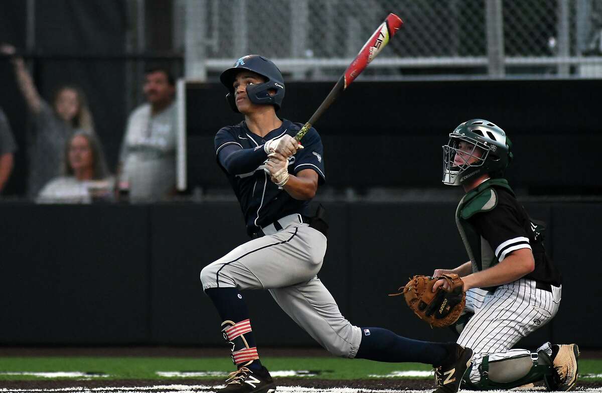 Kingwood pitcher Masyn Winn, left, and Clear Falls senior catcher Brooks Montgomery follow Winn's homerun to leftfield in the bottom of the third inning of Game One of their best of three series at Humble High School on May 10, 2019. (Photo by Jerry Baker)