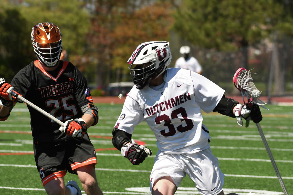 Hayden Frey, right, of Union men's lacrosse last season. He led the team with four goals in the loss to RIT.