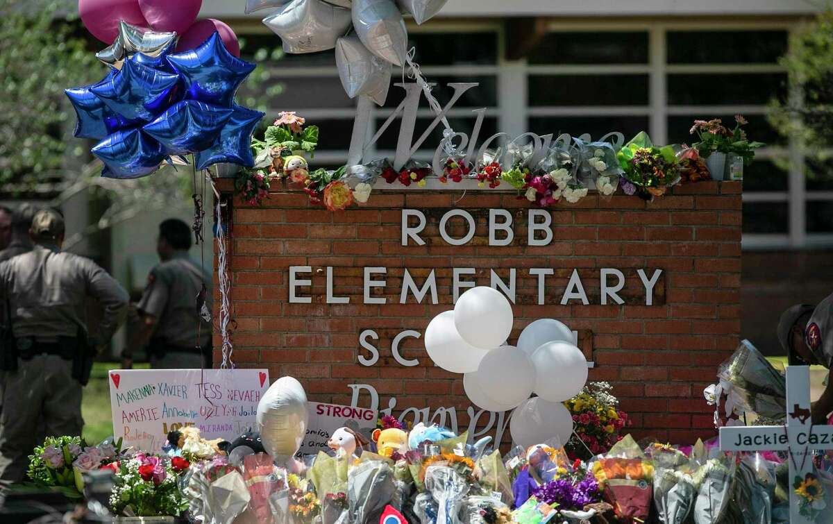 Ballons, flowers and other items adorn a memorial outside Robb Elementary School in Uvalde. On Tuesday, an 18-year-old gunman entered the school and killed at least 19 students and two educators.