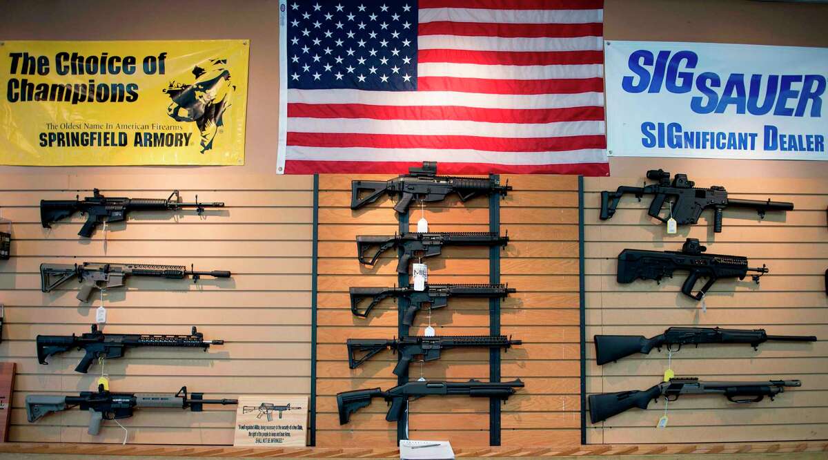 Assault rifles hang on the wall for sale at Blue Ridge Arsenal in Chantilly, Virginia, on October 6, 2017. / AFP PHOTO / JIM WATSONJIM WATSON/AFP/Getty Images