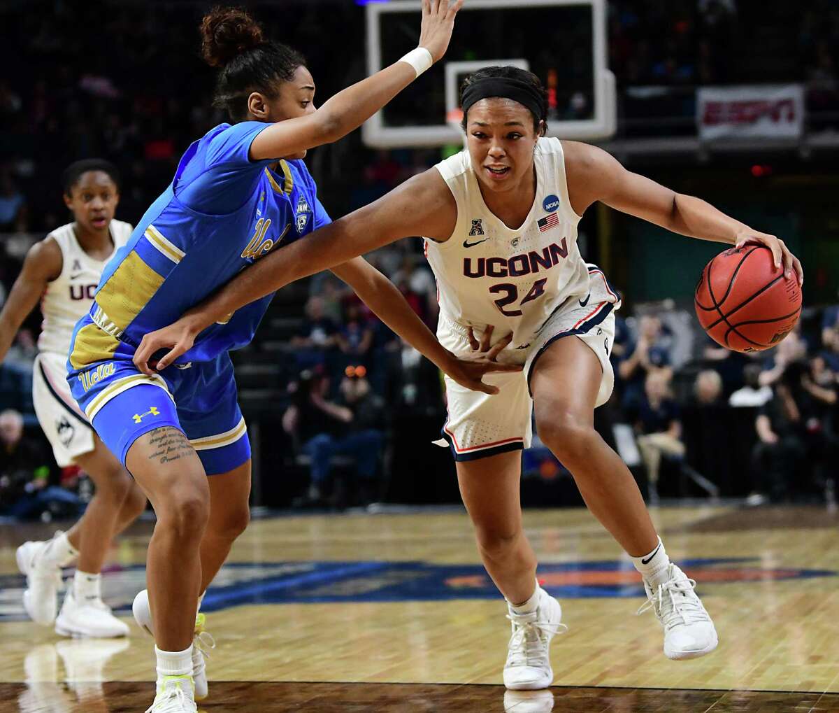 UConn’s Napheesa Collier drives to the net against UCLA’s Ahlana Smith in an NCAA Tournament semifinal game in 2019.