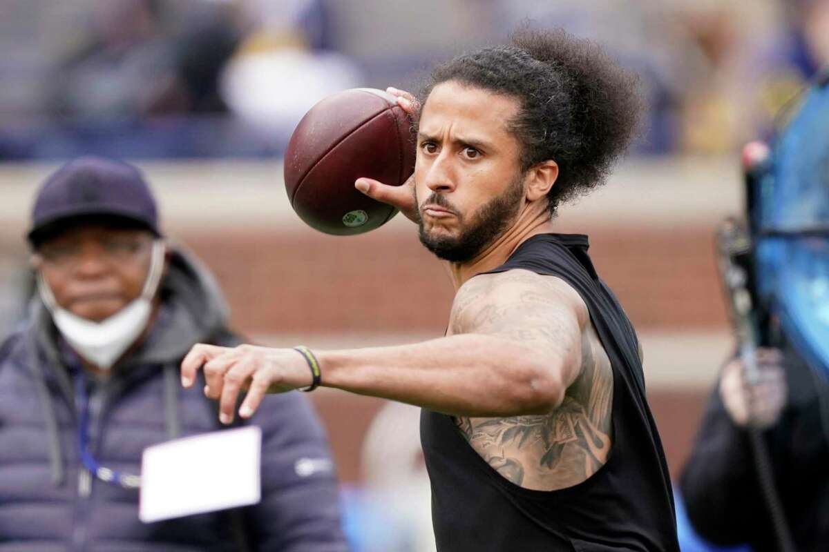 Free-agent quarterback Colin Kaepernick, shown throwing at halftime of the University of Michigan’s intrasquad game last month, worked out for the Las Vegas Raiders on Wednesday.